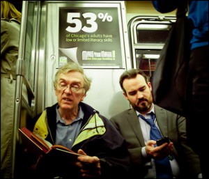 Men watching a smart phone on the train